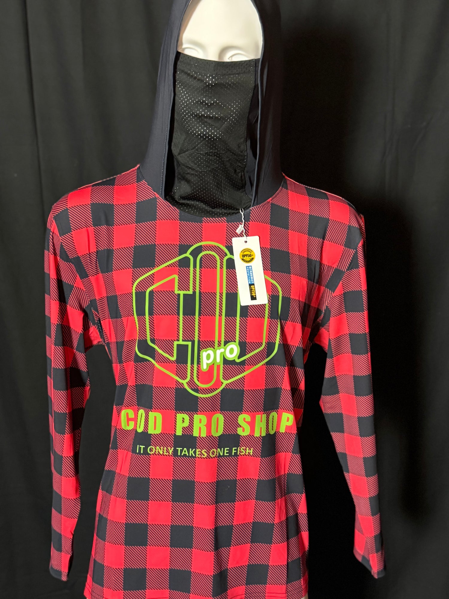 A person wearing a red and black checkered fishing shirt with a hood, featuring a graphic logo, cod pro shop