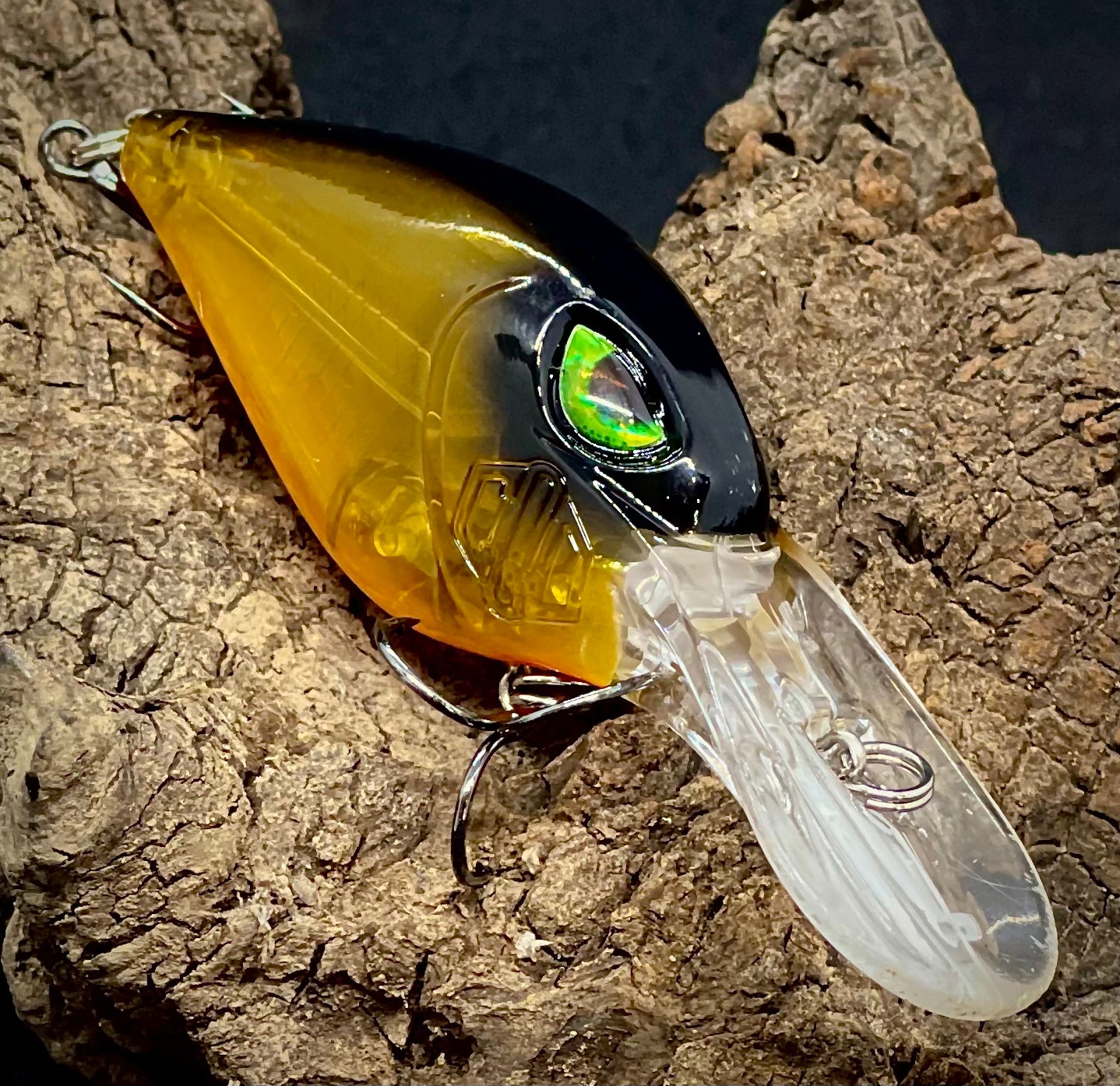 A yellow and black fishing lure with a green eye and transparent great for Murray cod