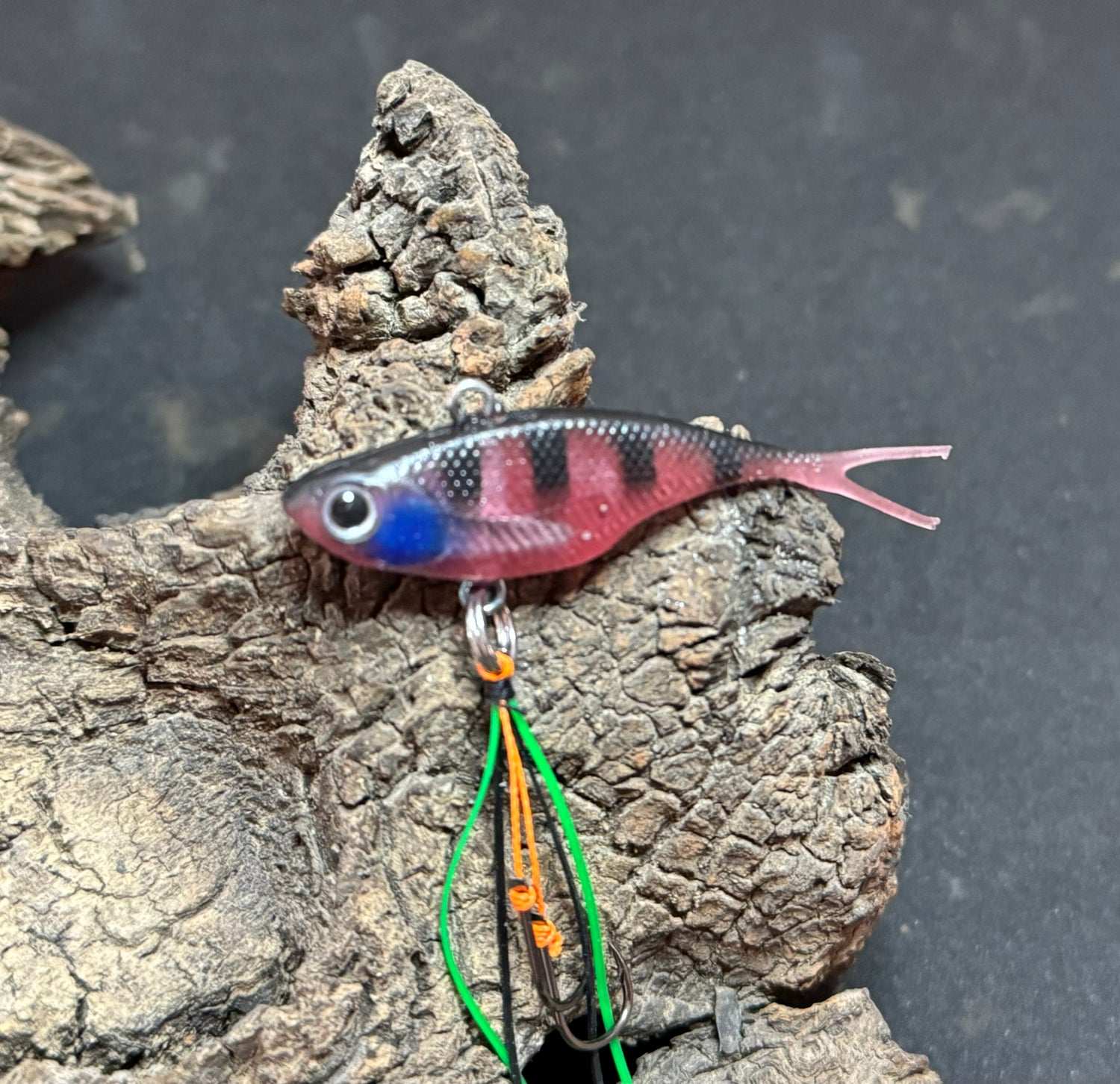 A pink with stripes coloured fishing lure named 'Shammy Vibes' soft vibe 55mm yellow belly assist hooks