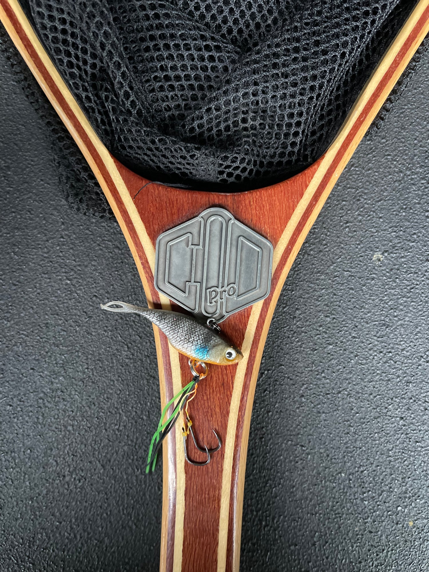 A grey with stripes coloured fishing lure named 'Shammy Vibes' soft vibe 55mm yellow belly assist hooks