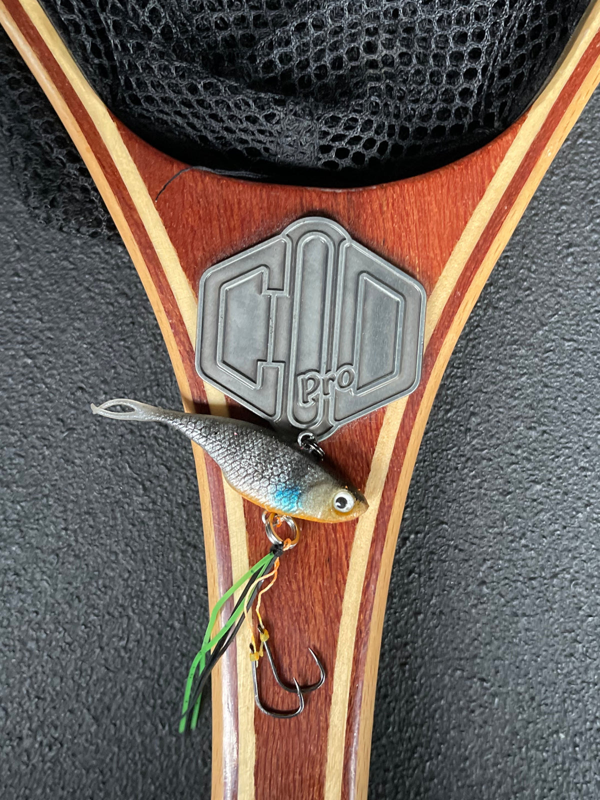 A grey with stripes coloured fishing lure named 'Shammy Vibes' soft vibe 55mm yellow belly assist hooks