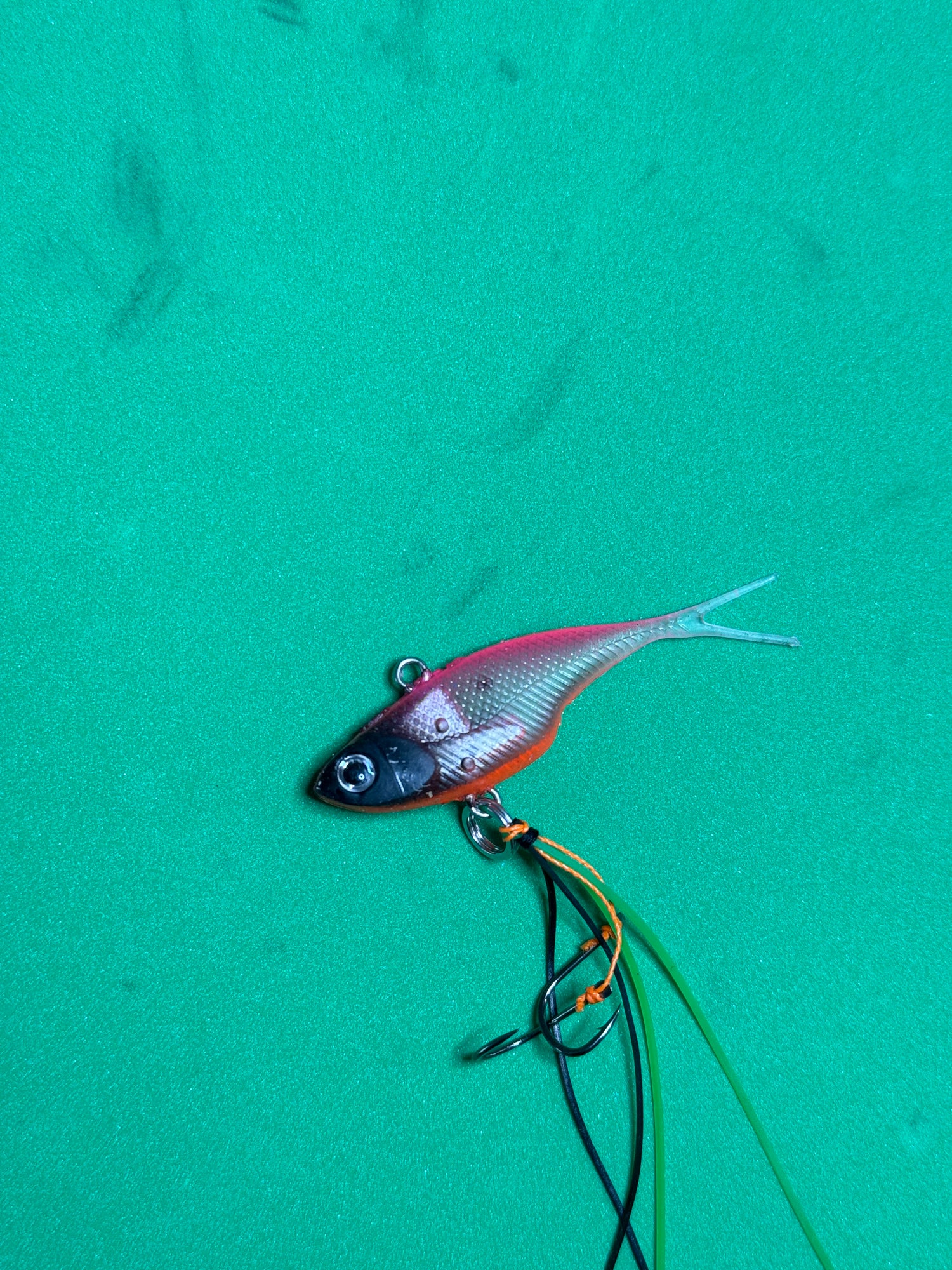 A pink with black head coloured fishing lure named 'Shammy Vibes' soft vibe 55mm yellow belly assist hooks