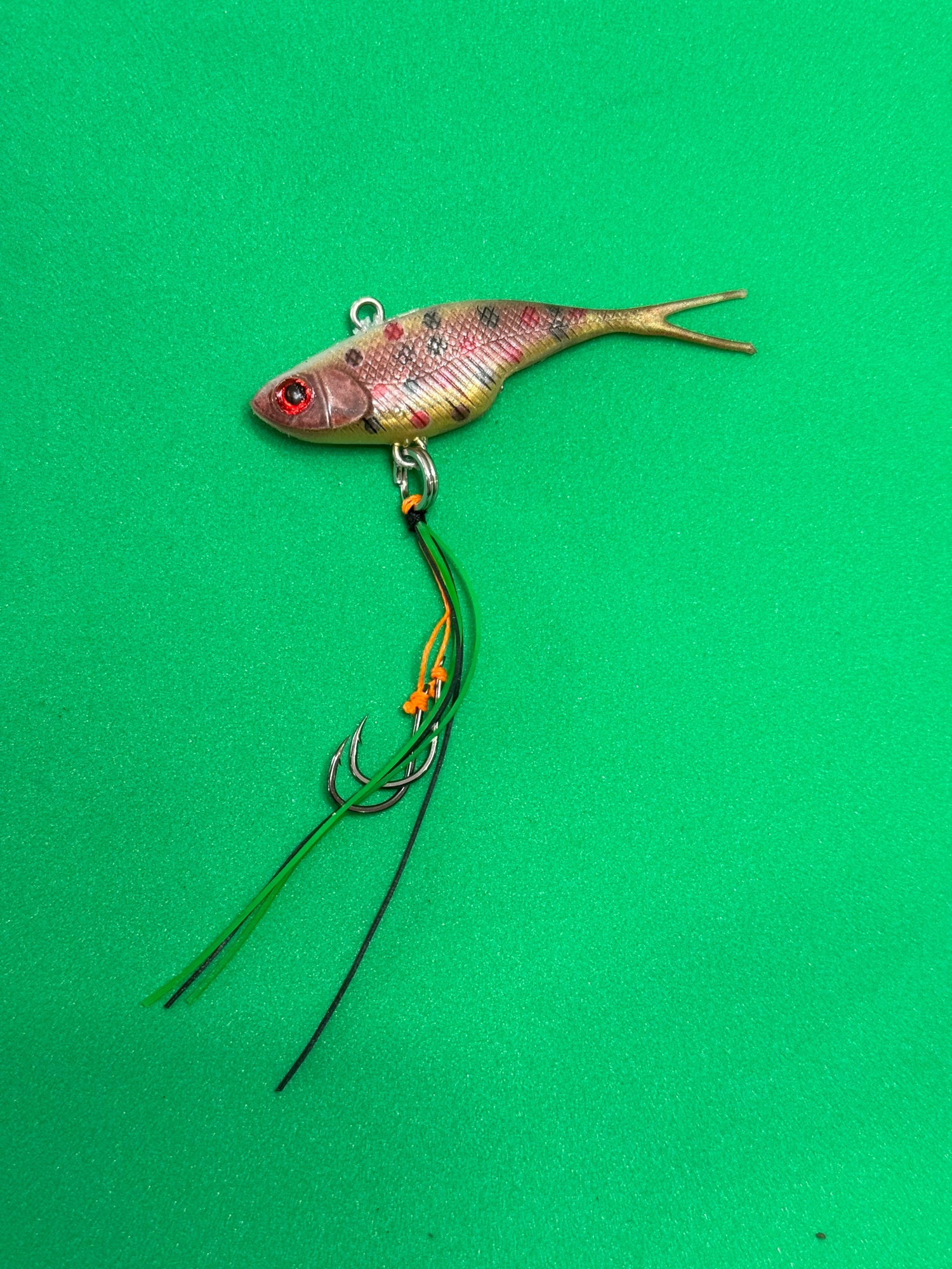A spotted dog coloured fishing lure named 'Shammy Vibes' soft vibe 55mm yellow belly assist hooks