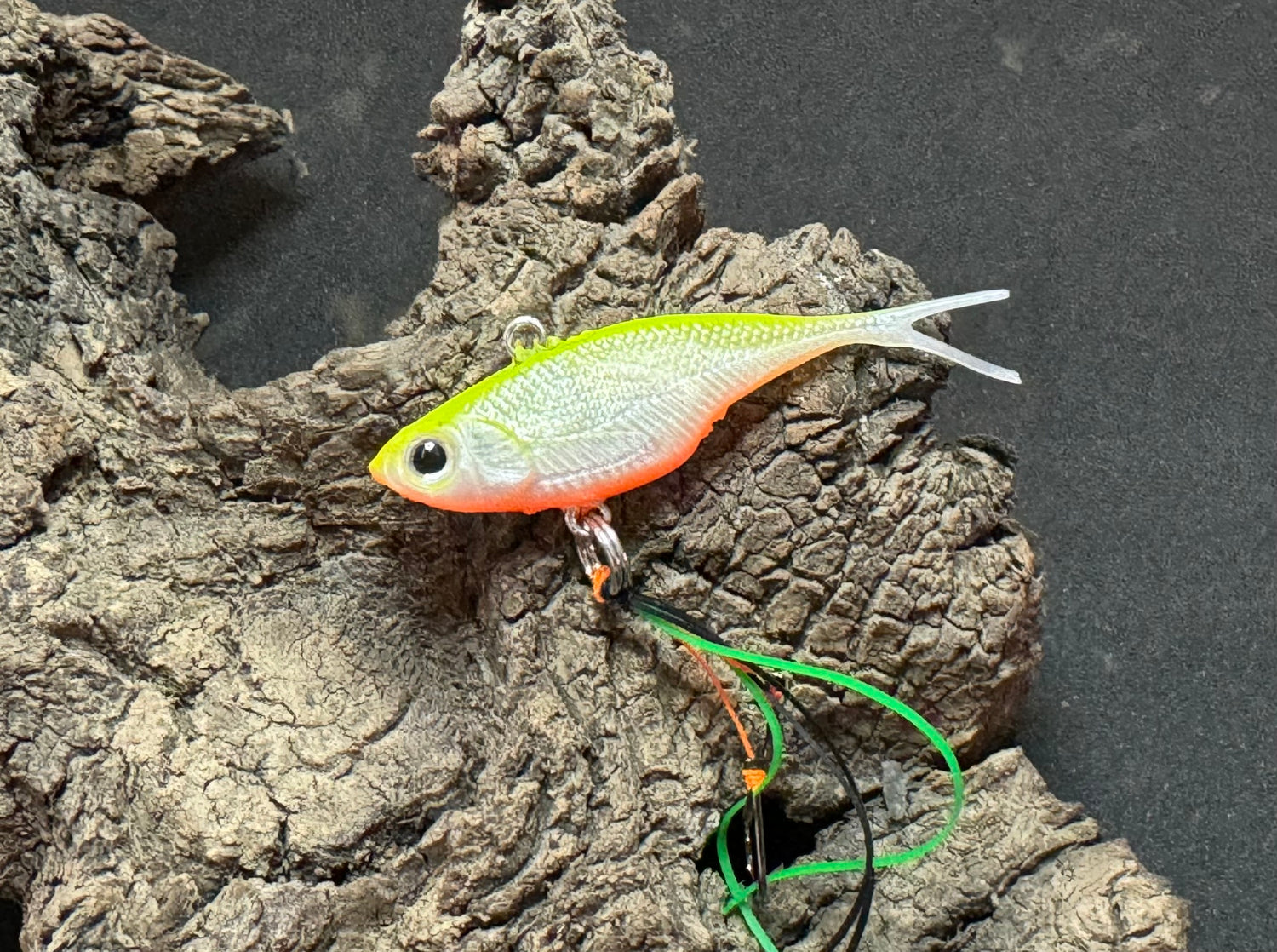 A yellow top white and orange bottom coloured fishing lure named 'Shammy Vibes' soft vibe 55mm yellow belly assist hooks