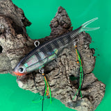 A multicoloured fishing lure with a vibrating tail designed to imitate the movement of fish, equipped with two sets of stinger hooks.