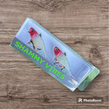 A red and white coloured fishing lure named 'Shammy Vibes' soft vibe 55mm yellow belly assist hooks
