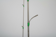 Fishing rod with green accents on a gray background